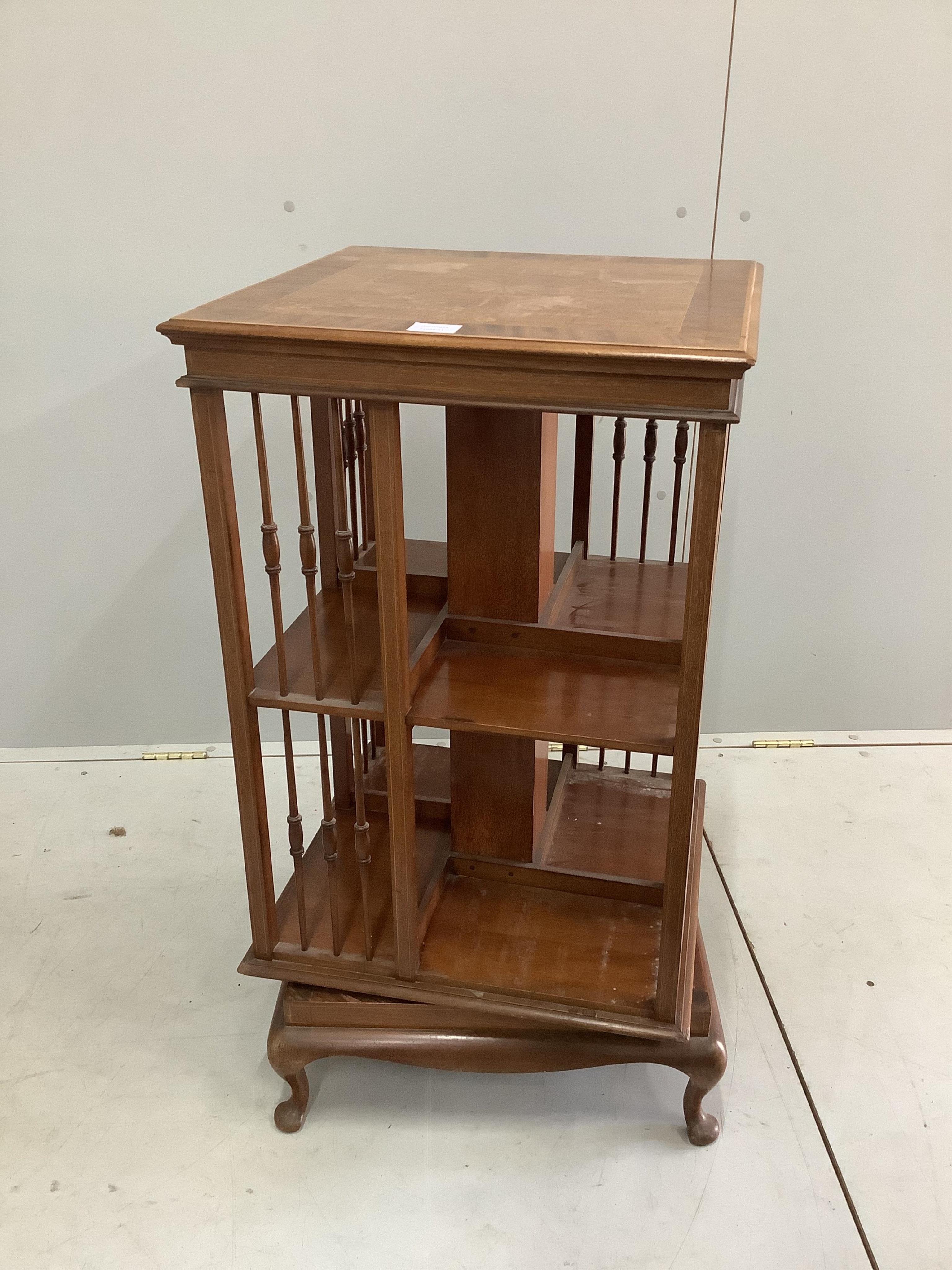 An early 20th century inlaid mahogany square revolving bookcase, 49cm, height 88cm. Condition - fair